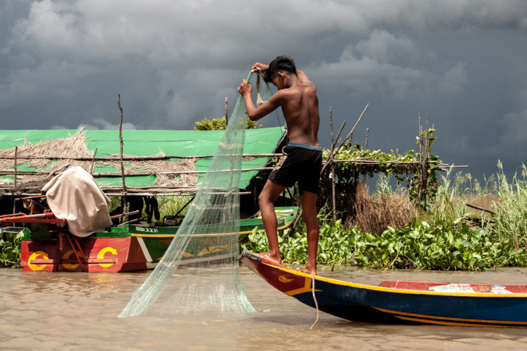 A young fisherman uses a legal net.