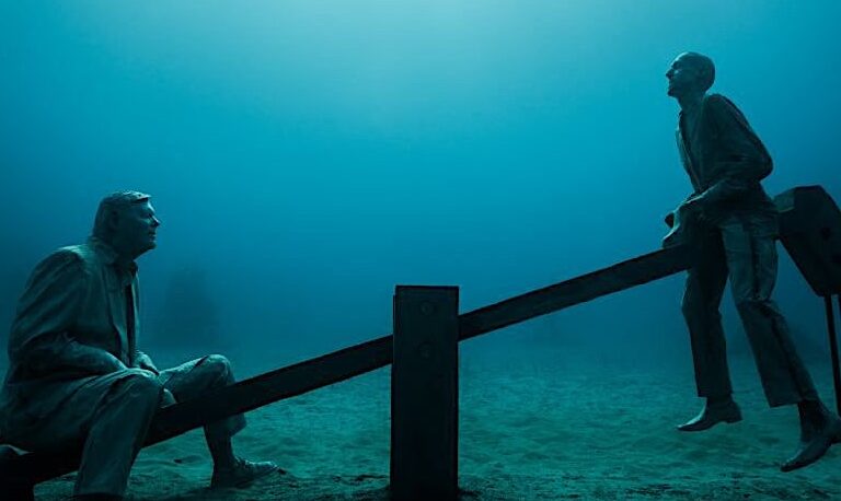 "Deregulated" depicts men in suits playing in a children’s playground as part of a series of sculptures by Jason deCaires Taylor installed in the sea near the Canary Islands.