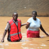 Kenya Red Cross volunteer rescuing a resident.