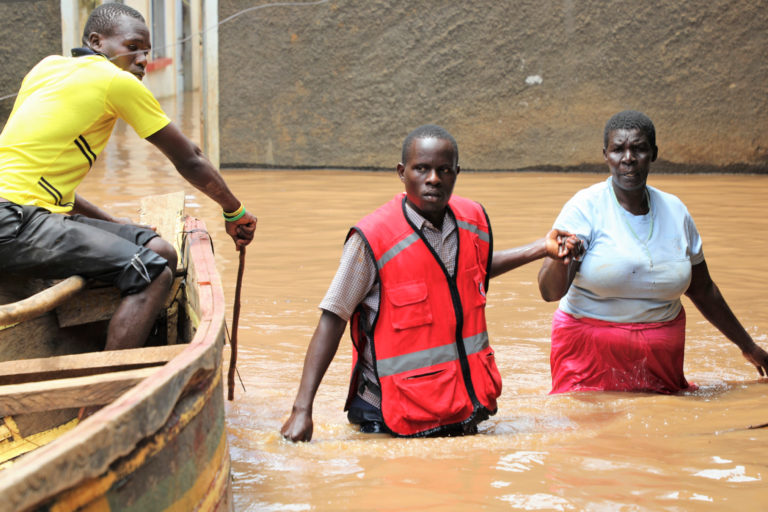 Kenya Red Cross volunteer rescuing a resident.