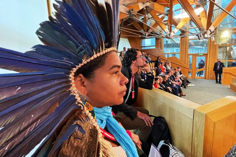 Glicéria Tupinambá watches First Minister's Questions in the Scottish Parliament.