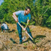 A man planting a tree.