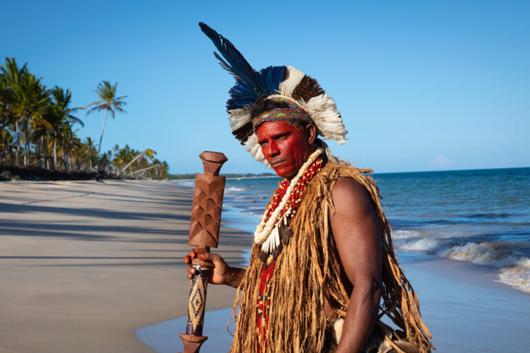 Chief Patiburi Pataxó stands on the beach of the reclaimed Quero-Ver community.