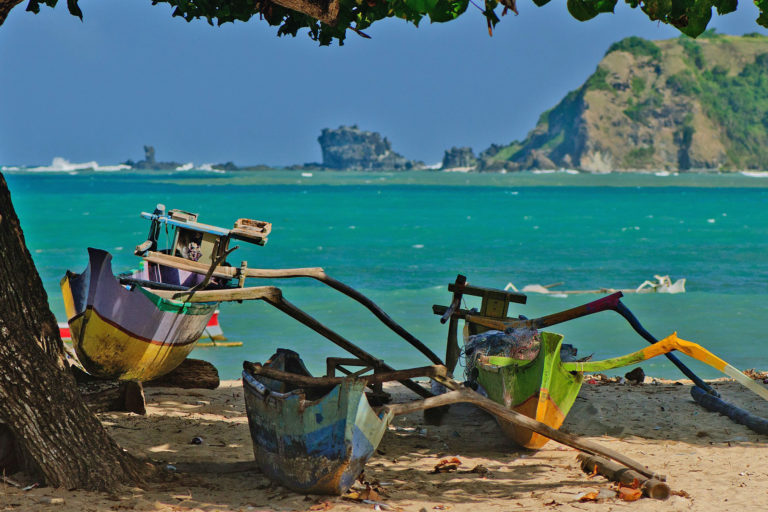 Traditional fishing boats on a Lombok beach.