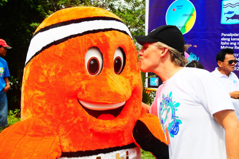 Brett Jenks visits with Mabi, the clown fish mascot of a community Pride campaign in the Philippines in 2011. Photo credit: Rare