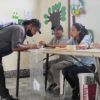 A resident of Asunción Mita confirms his identity and signature to vote in a school classroom during a municipal referendum on mining. Image by Sandra Cuffe.