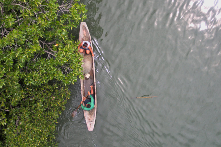 Fishers in a boat in the Malampaya Sound mangroves.