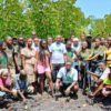 Kelly Banda (center, standing) with volunteers and community members.