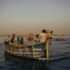 Fishermen at dawn heading out onto Lake Turkana to try their luck for the day. Image by Kang-Chun Cheng.