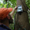 TNC scientist Eddie Game checks an acoustic recorder in Papua New Guinea. Photo © Justine E. Hausheer / The Nature Conservancy