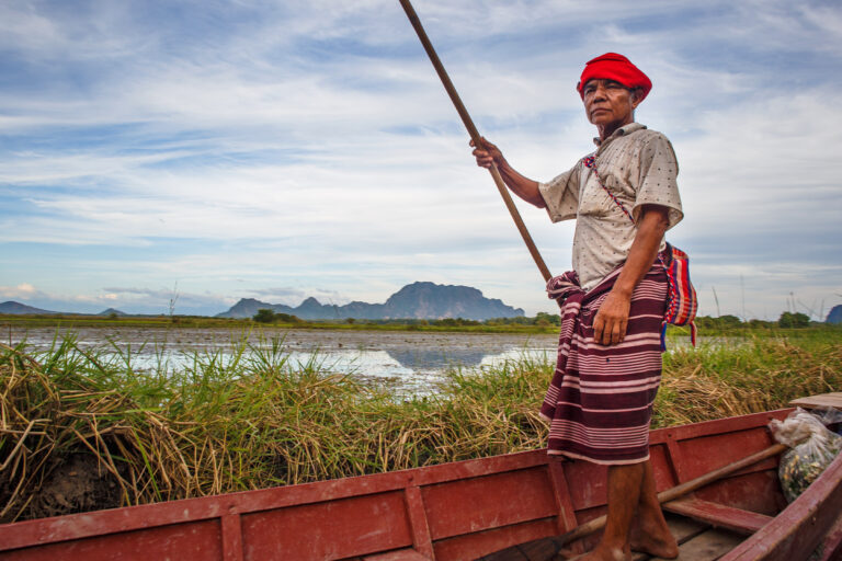 A Karen man in his boat in Myanmar.