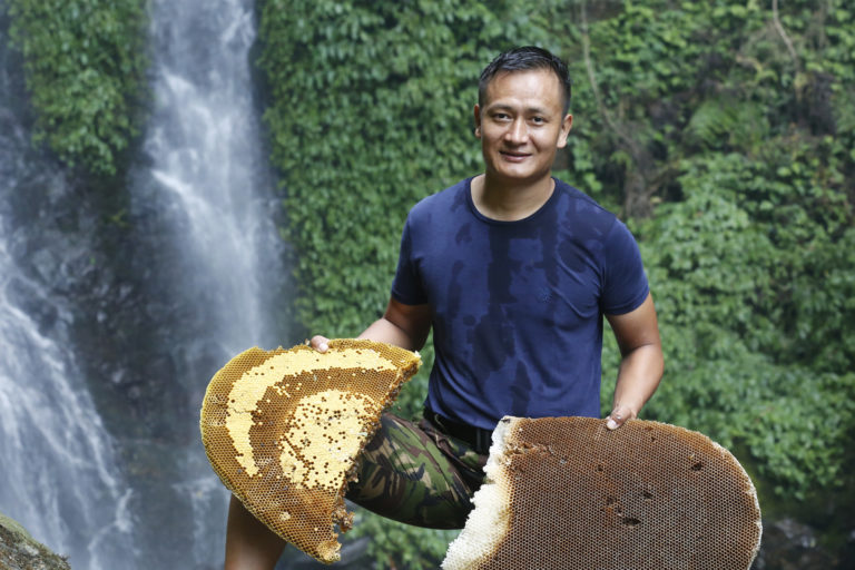 A Nepali honey collector.