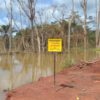 A mining pit transformed into an artificial lake after a mining company’s semi-mechanized operations. Image © Yannick Kenné.