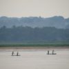 Pirogues on the Kasai River with forests on the far bank. Image by Terese Hart via Flickr.