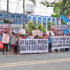 Activists and Indigenous peoples holding a protest.