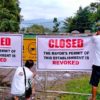 Tampakan government employees close a facility belonging to Sagittarius Mines, Inc.